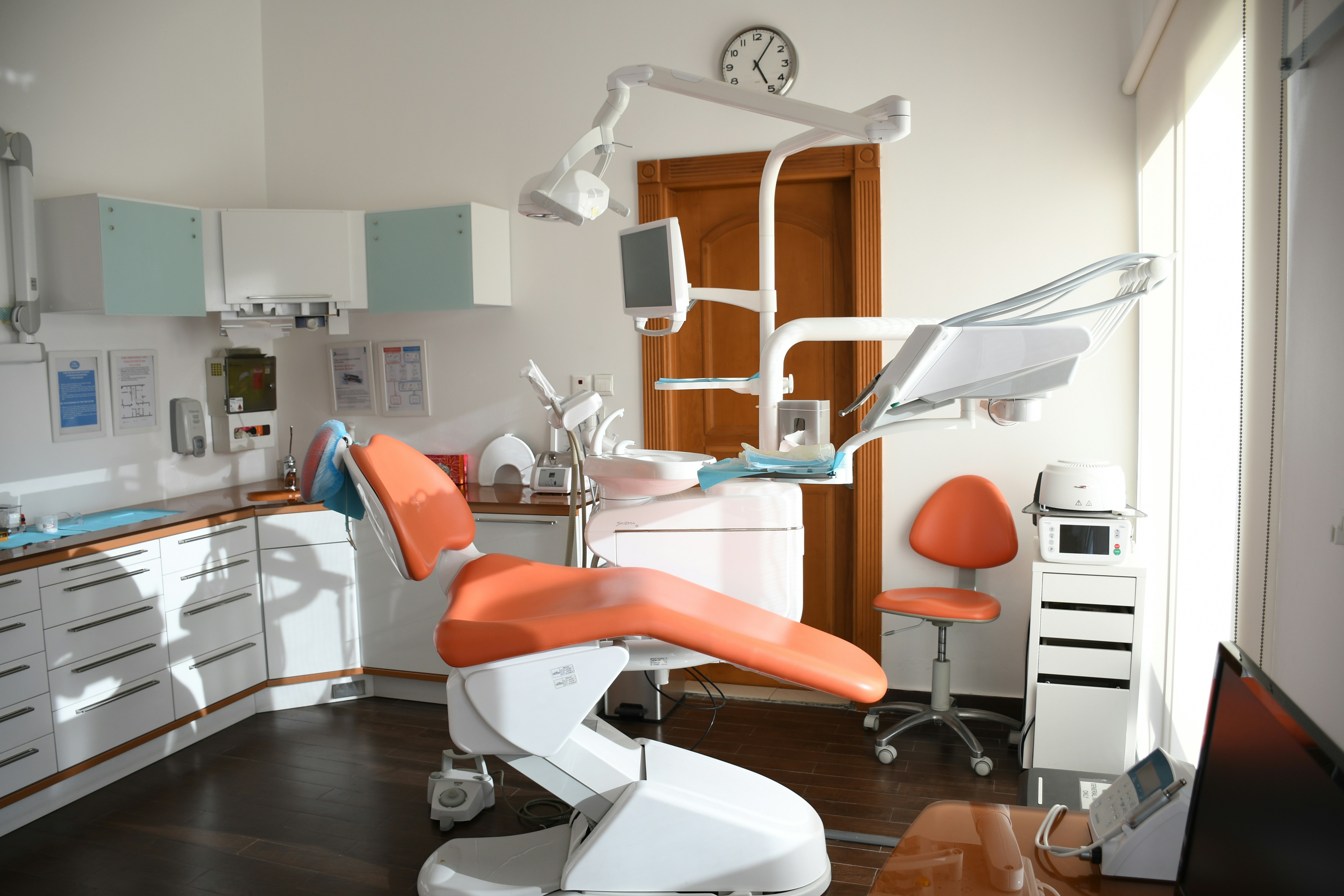 Dentist gently consulting patient
